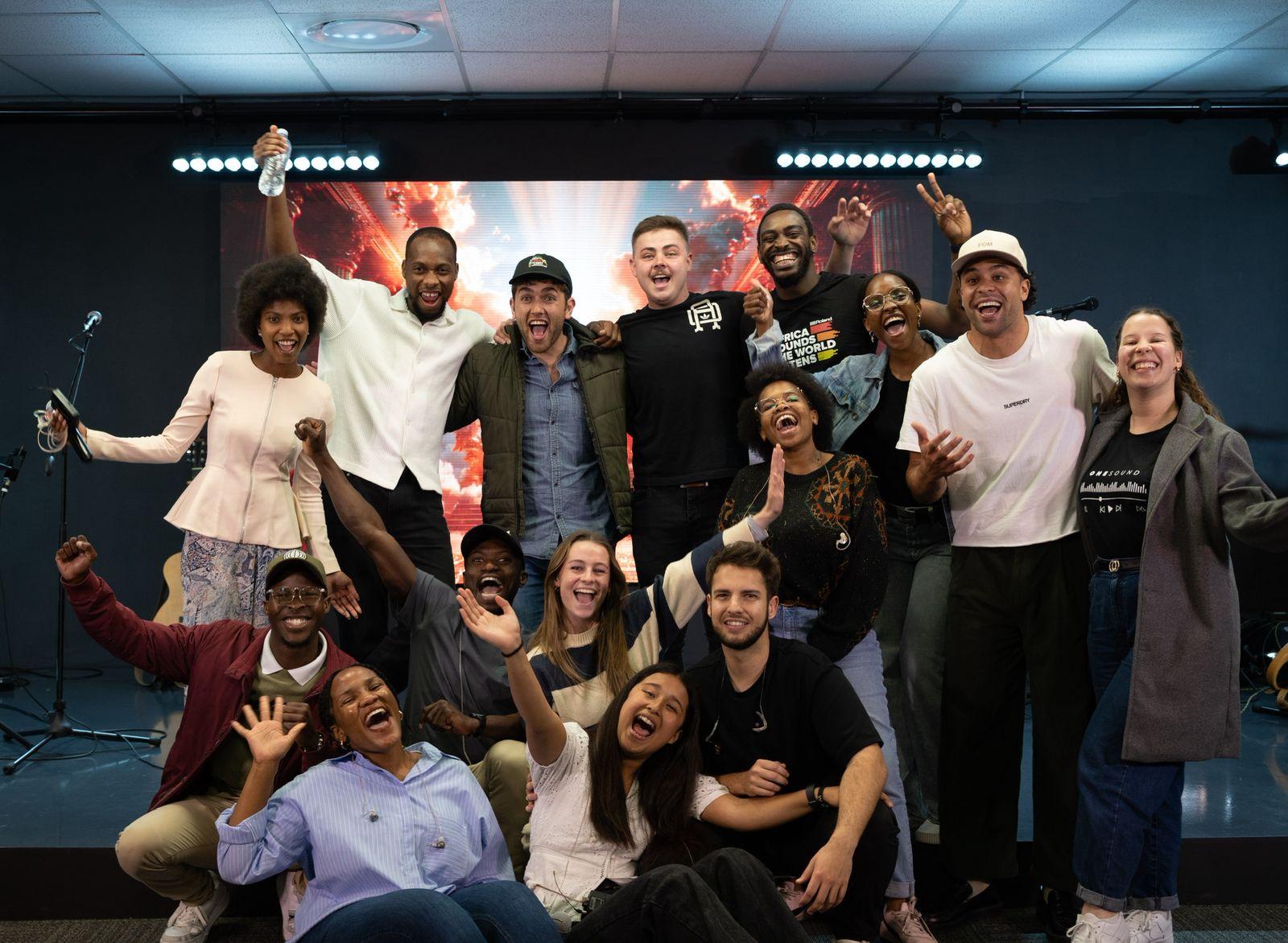 A group of young adults cheering and celebrating together