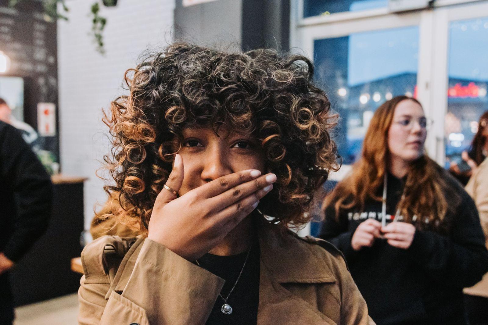 A candid portrait of someone laughing