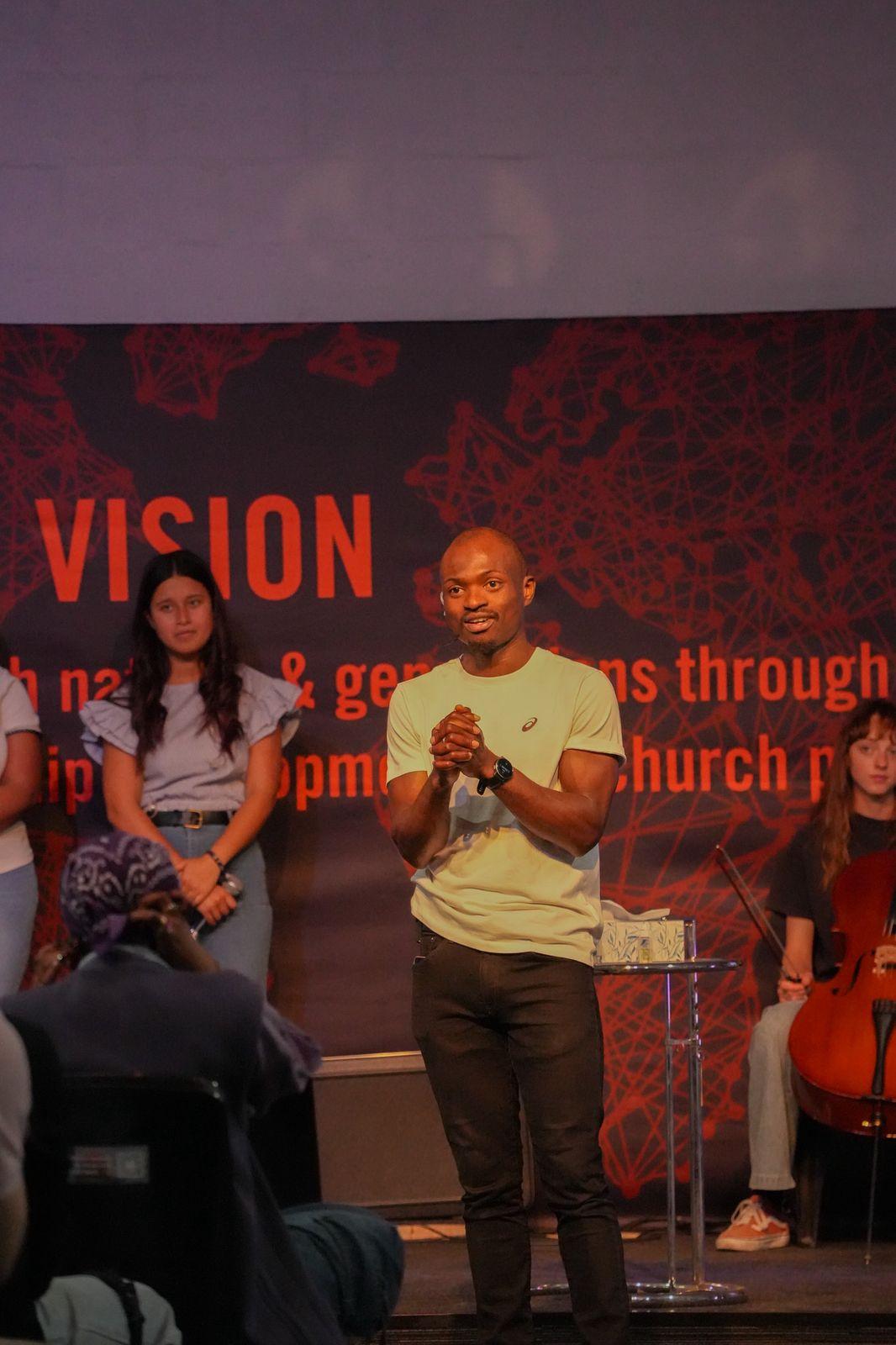 Someone sharing at the front of a gathering