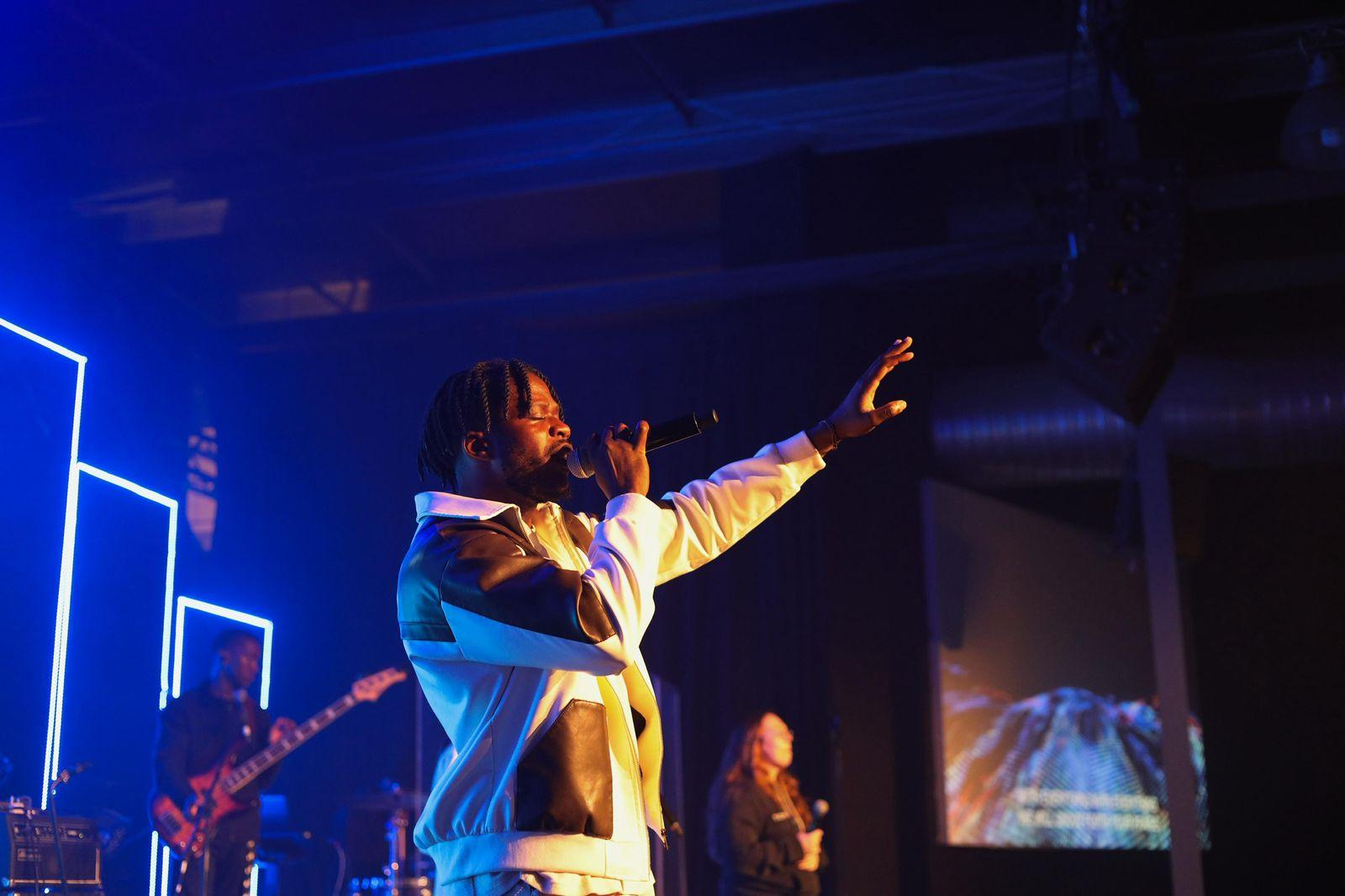 Leading worship with hands raised